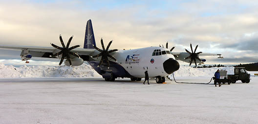 NSF NCAR C-130 aircraft right before its first mission in Kiruna, Sweden during the Cold Air Outbreak Experiment in the Sub-Arctic Region (CAESAR) field campaign. The CAESAR team will fly the C-130 through Arctic conditions to collect data on marine cold air outbreaks and Arctic cloud behavior. The purpose of the field project is to better understand the warming in the Arctic. (NSF UCAR/Daniel Zietlow)
