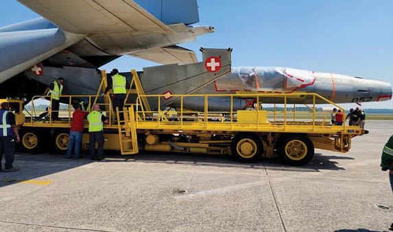 The first of 22 repatriated Swiss F-5 Tiger II aircraft arrived at the Tactical Air Support facility at Cecil Field in Jacksonville, Florida, March 21 for the second phase of the Avionics Reconfiguration and Tactical/Modernization for Inventory Standardization (ARTEMIS) program, ferried by a U.S. Marine Corps C-130J from Marine Aerial Refueler Transport Squadron (VMGR) 234.