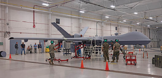 U.S. Marines with Marine Unmanned Aerial Vehicle Training Squadron (VMUT) 2 conduct familiarization training with an MQ-9A Reaper unmanned aircraft at Marine Corps Air Station Cherry Point, North Carolina, April 11, 2024. Marines with VMUT-2 worked alongside civilian contractors to conduct familiarization training with VMUT-2’s first delivered and assembled MQ-9A Reaper unmanned aircraft. VMUT-2 will serve as the Marine Corps MQ-9A Reaper Fleet Replacement Squadron, whose primary mission is to train 7318 unmanned aerial systems officers and 8022 enlisted sensor operators. (U.S. Marine Corps photo by Lance Cpl. Orlanys Diaz Figueroa)