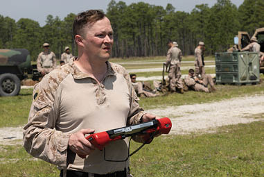 U.S. Marine Corps Master Sgt. Todd Grindstaff, a native of Missouri and a weapons and tactics training chief with Headquarters and Service Battery, 2nd Low Altitude Air Defense (LAAD) Battalion, operates a drone during a counter-unmanned aircraft system (UAS) range on Marine Corps Base Camp Lejeune, North Carolina, April 16, 2024. 2nd LAAD Battalion conducted a dynamic, tactical scenario-driven counter-UAS aerial-gunnery range in which Marines had to shoot, maneuver, and communicate while directly engaging UAS aircraft. (U.S. Marine Corps photo by Lance Cpl. Anakin Smith)