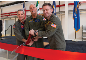 NAVAL AIR STATION SIGONELLA, Italy (March 2, 2024) - Capt. Ronald H. Rumfelt, Jr., commanding officer, Unmanned Patrol Squadron (VUP) 19 “Big Red" (left), Vice Adm. Daniel “Undra” Cheever, Commander, Naval Air Forces (center), and Capt. Aaron Shoemaker, commanding officer, Naval Air Station (NAS) Sigonella (right), participate in a ribbon cutting ceremony to celebrate the inaugural deployment of VUP- 19's second forward-deployed detachment, and the opening of a new MQ-4C Triton hangar at NAS Sigonella, Italy, March 2, 2024. VUP- 19 is the first and only unmanned patrol squadron and will set a baseline for training Sailors and officers on the tactics, techniques and procedures of operating the MQ-4C Triton for future warfighting. (U.S. Navy Photo by Mass Communication Specialist 2nd Class Sebastian Portieleslopez/Released)