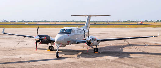 A T-54 multi-engine aircraft sits on the flightline of Naval Air Station (NAS) Corpus Christi, April 18. The arrival of the T-54A heralds a new generation of Naval Aviators who will use the trainer to earn their wings of gold as they prepare to fly such aircraft as the P-8A Poseidon, E-2D Hawkeye, and C-130 Herculese. The T-54A recplaces the T-44C Pegasus, an aircraft that has been in naval service since 1977. (U.S. Navy Photo by Anne Owens/Released)