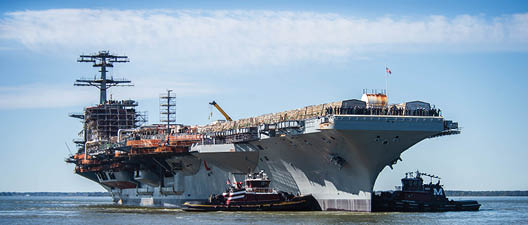 240408-N-JJ744-1227 NEWPORT NEWS, Va. (April 8, 2024) - The Nimitz-class aircraft carrier USS John C. Stennis (CVN 74) is moved to an outfitting berth in Newport News, Virginia, April 8, 2024. John C. Stennis is in Newport News Shipbuilding conducting Refueling and Complex Overhaul to prepare the ship for the second half of its 50-year service life. (U.S. Navy photo by Mass Communication Specialist 2nd Class Simon Pike)