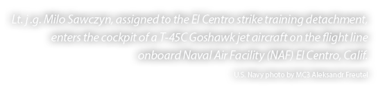Lt. j .g. Milo Sawczyn, assigned to the El Centro strike training detachment, enters the cockpit of a T 45C Goshawk j...