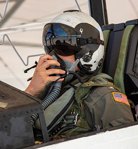 EL CENTRO, Calif. (July 19, 2023) Lt. XX Cummins, assigned to the El Centro strike training detachment, dons an oxygen mask in a T-45C Goshawk jet aircraft on the flight line onboard Naval Air Facility (NAF) El Centro, Calif. July 19, 2023. NAF El Centro supports combat training and readiness of the Warfighter. This includes air operations support to operational fleet and training squadrons as well as squadrons from other services (USMC, USA, USAF) and Allies. (U.S. Navy photo by Mass Communication Specialist 3rd Class Aleksandr Freutel)