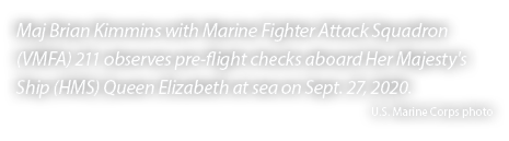 Maj Brian Kimmins with Marine Fighter Attack Squadron (VMFA) 211 observes pre flight checks aboard Her Majesty's Ship...