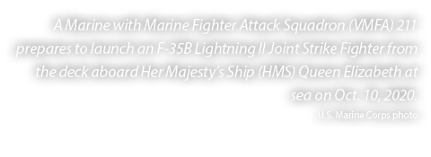 A Marine with Marine Fighter Attack Squadron (VMFA) 211 prepares to launch an F 35B Lightning II Joint Strike Fighter...