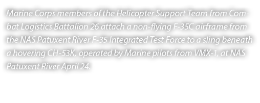 Marine Corps members of the Helicopter Support Team from Combat Logistics Battalion 26 attach a non flying F 35C airf...