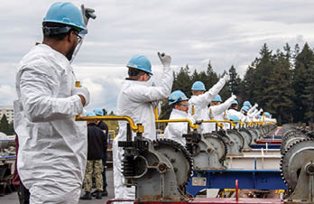 Sailors prepare to lower the catapult of the aircraft carrier USS Nimitz (CVN 68) while in port at Naval Base Kitsap-Bremerton, Washington, March 5, 2024. Nimitz is in port for a scheduled planned incremental availability period. (U.S. Navy photo by Mass Communication Specialist Seaman Apprentice Joseph M. Paolucci)