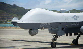 A U.S. Marine Corps MQ-9A MUX/MALE assigned to Marine Unmanned Aerial Vehicle Squadron (VMU) 3, Marine Aircraft Group 24, 1st Marine Aircraft Wing completes preflight checklist during the first Satellite Communications (SATCOM) Launch and Recovery (SLR) mission at Marine Corps Air Station Kaneohe Bay, Hawaii, June 20, 2024. SLR minimizes logistical constraints, enables operations from short airfields over vast distances, and supports the flexibility required for modern expeditionary operations. VMU-3's successful SLR demonstration emphasized its pivotal role in advancing Marine Corps capabilities in reconnaissance, surveillance, and target acquisition missions across the Indo-Pacific region. (U.S. Marine Corps photo by Cpl. Joseph Abreu)