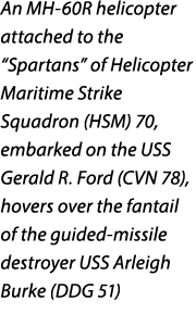 An MH 60R helicopter attached to the “Spartans” of Helicopter Maritime Strike Squadron (HSM) 70, embarked on the USS ...