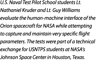 U.S. Naval Test Pilot School students Lt. Nathaniel Kruder and Lt. Guy Williams evaluate the human machine interface ...