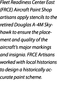 Fleet Readiness Center East (FRCE) Aircraft Paint Shop artisans apply stencils to the retired Douglas A 4M Skyhawk to...