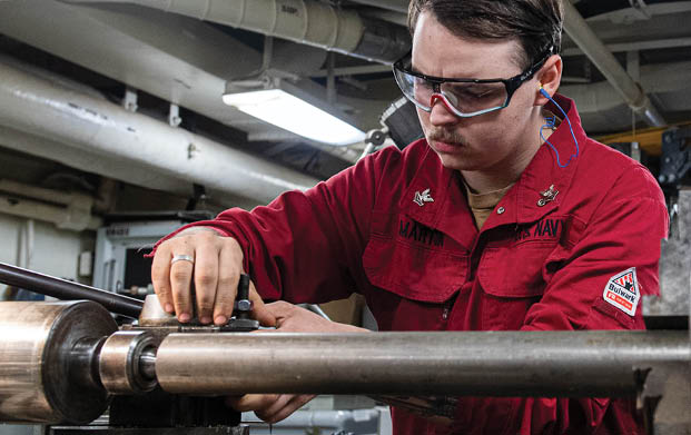 240604-N-ER894-1032 PHILIPPINE SEA (June 4, 2024) Machinery Repairman 2nd Class Kyle Martin, from Houston, adjusts a lathe before turning a piece of steel in the machine repair shop aboard the U.S. Navy’s only forward-deployed aircraft carrier, USS Ronald Reagan (CVN 76), in the Philippine Sea, June 4. Ronald Reagan, the flagship of Carrier Strike Group 5, provides a combat-ready force that protects and defends the United States, and supports alliances, partnerships and collective maritime interests in the Indo-Pacific region. (U.S. Navy photo by Mass Communication Specialist 2nd Class Timothy Dimal)