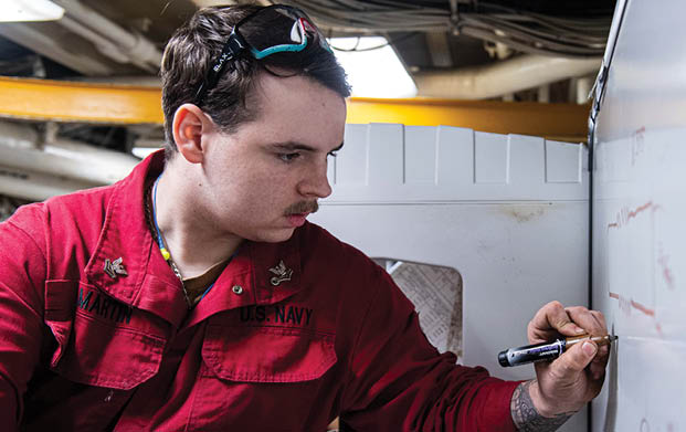 240604-N-ER894-1079 PHILIPPINE SEA (June 4, 2024) Machinery Repairman 2nd Class Kyle Martin, from Houston, sketches a diagram of a valve seat wrench in the machine repair shop aboard the U.S. Navy’s only forward-deployed aircraft carrier, USS Ronald Reagan (CVN 76), in the Philippine Sea, June 4. Ronald Reagan, the flagship of Carrier Strike Group 5, provides a combat-ready force that protects and defends the United States, and supports alliances, partnerships and collective maritime interests in the Indo-Pacific region. (U.S. Navy photo by Mass Communication Specialist 2nd Class Timothy Dimal)