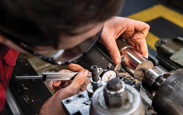 240604-N-ER894-1066 PHILIPPINE SEA (June 4, 2024) Machinery Repairman 2nd Class Kyle Martin, from Houston, uses a dial caliper to measure the outside diameter of a piece of steel in the machine repair shop aboard the U.S. Navy’s only forward-deployed aircraft carrier, USS Ronald Reagan (CVN 76), in the Philippine Sea, June 4. Ronald Reagan, the flagship of Carrier Strike Group 5, provides a combat-ready force that protects and defends the United States, and supports alliances, partnerships and collective maritime interests in the Indo-Pacific region. (U.S. Navy photo by Mass Communication Specialist 2nd Class Timothy Dimal)
