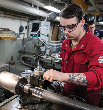 240604-N-ER894-1049 PHILIPPINE SEA (June 4, 2024) Machinery Repairman 2nd Class Kyle Martin, from Houston, operates a lathe to turn a piece of steel in the machine repair shop aboard the U.S. Navy’s only forward-deployed aircraft carrier, USS Ronald Reagan (CVN 76), in the Philippine Sea, June 4. Ronald Reagan, the flagship of Carrier Strike Group 5, provides a combat-ready force that protects and defends the United States, and supports alliances, partnerships and collective maritime interests in the Indo-Pacific region. (U.S. Navy photo by Mass Communication Specialist 2nd Class Timothy Dimal)