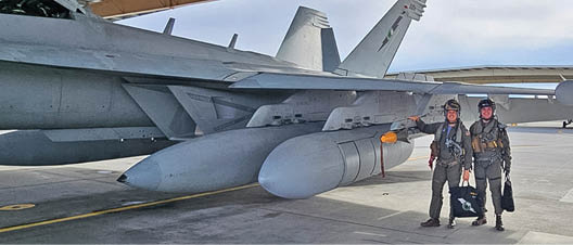 FALLON, NV.– U.S. Navy Lt. Matt Haney prepares to fly the EA-18G Growler at Naval Aviation Warfighting Development Center (NAWDC). Haney is an instructor at the Airborne Electronic Attack Weapons School enrolled in the new Masters of Warfare Operations (MWO) degree program at the Naval Postgraduate School. He is in the first MWO cohort of TOPGUN students and instructors that began in Jan. 2025, with courses in strategic competition, combat systems analysis and statistics, naval tactics and technologies, and space systems fundamentals. (U.S. Navy graphic courtesy of Lt. Matt Haney.)