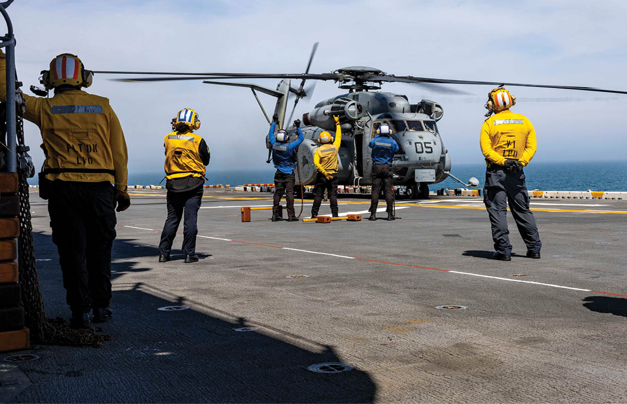 ATLANTIC OCEAN (April 5, 2025) Sailors assigned to the amphibious assault ship USS Wasp (LHD 1) facilitate deck landing qualifications for an MH-53E Sea Dragon, assigned to the “Blackhawks” of Helicopter Mines Countermeasures Squadron 15 (HM-15), on the ship’s flight deck, April 5, 2025. Wasp is underway conducting routine operations in the Atlantic Ocean. (U.S. Navy photo by Mass Communication Specialist Seaman Soren V.P. Quinata)
