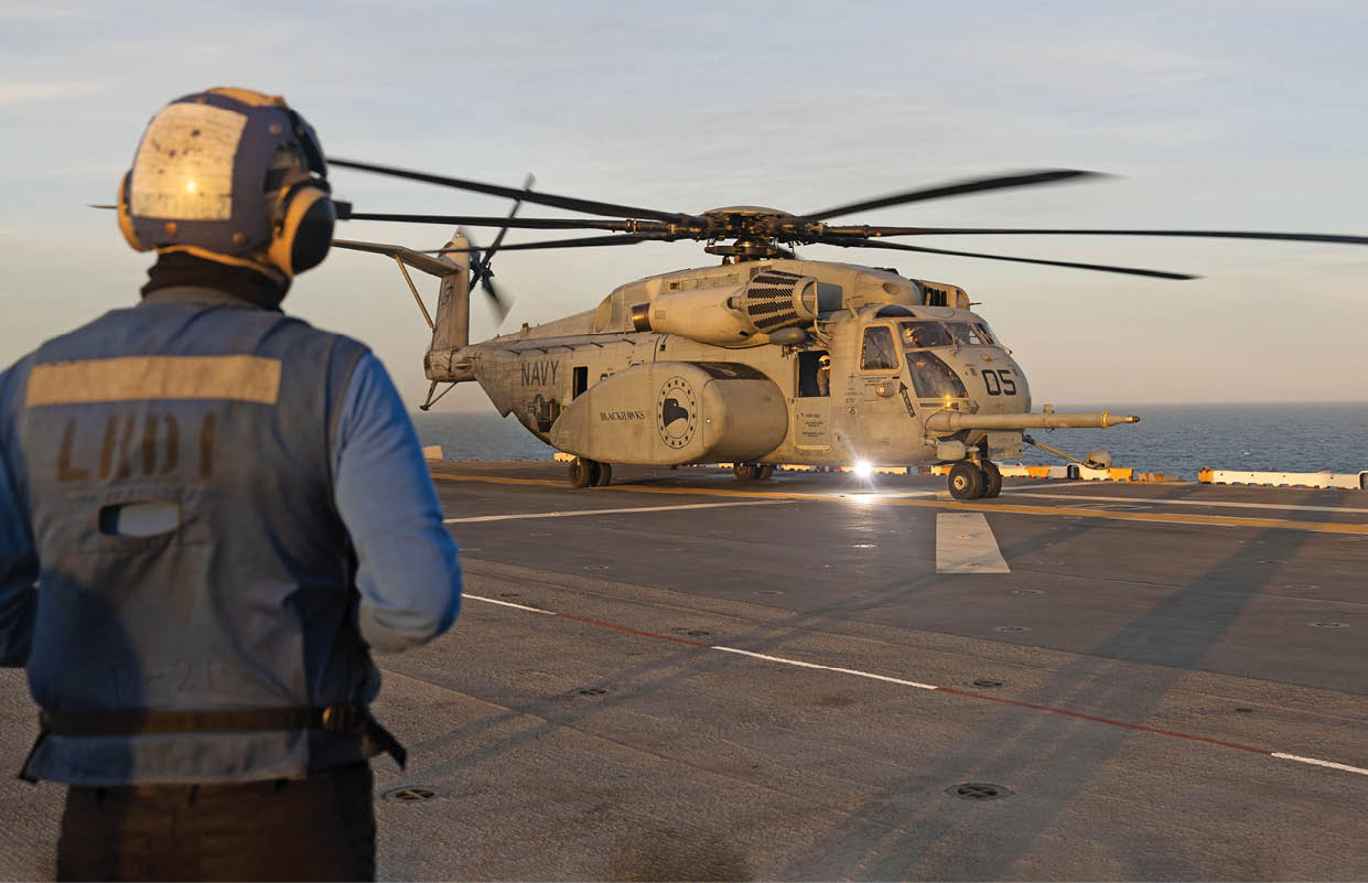 ATLANTIC OCEAN (April 5, 2025) Aviation Boatswain’s Mate (Handling) Airman Miguel Martinez, assigned to the amphibious assault ship USS Wasp (LHD 1), prepares to chock and chain an MH-53E Sea Dragon, assigned to the “Blackhawks” of Helicopter Mines Countermeasures Squadron 15 (HM-15), on the ship’s flight deck, April 5, 2025. Wasp is underway conducting routine operations in the Atlantic Ocean. (U.S. Navy photo by Mass Communication Specialist Seaman Savannah Lujan)