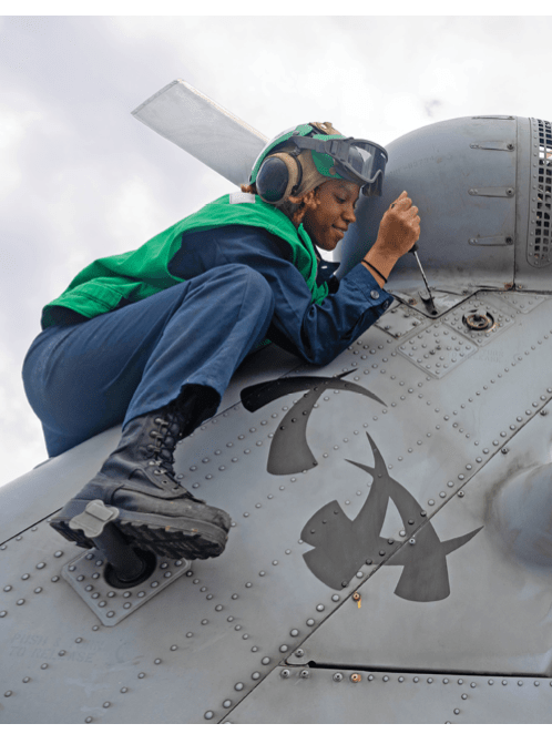 Aviation Structural Mechanic 2nd Class Kristiana Tyler, from Broken Arrow, Oklahoma, assigned to Helicopter Maritime Strike Squadron (HSM) 51, installs a tail fastener to an MH-60R Sea Hawk on the flight deck of the Arleigh Burke-class guided-missile destroyer USS Preble (DDG 88) in the Philippine Sea, Nov. 30, 2024. Preble is forward-deployed and assigned to Destroyer Squadron (DESRON) 15, the Navy's largest DESRON and the U.S. 7th Fleet's principal surface force. (U.S. Navy photo by Mass Communication Specialist 1st Class Ryre Arciaga)