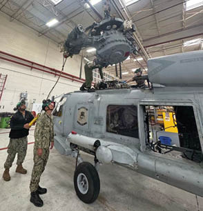 SAN DIEGO -- Center for Naval Aviation Technical Training students, overseen by Helicopter Maritime Strike Squadron (HSM) 35 staff, perform routine maintenance on a MH-60 helicopter. (U.S. Navy photo)