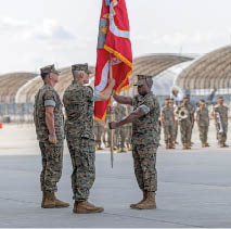 U.S. Marine Corps Sgt. Maj. Steven E. Buckom, from North Carolina, command senior enlisted leader, Marine All-Weather Fighter Attack Squadron (VMFA(AW)) 224, passes the Marine Corps colors to Lt. Col. Jarrod Allen, from California, the outgoing commanding officer of VMFA(AW)-224, during a squadron redesignation and change of command ceremony at Marine Corps Air Station Beaufort, South Carolina, June 26, 2025. The ceremony represented the squadron's transition from an all-weather F/A-18D Hornet squadron to an F-35B Lightning II squadron and signified the transfer of responsibility, authority, and accountability from Allen to Lt. Col John P. Stuart. (U.S. Marine Corps photo by Lance Cpl. Gavin K. Kulczewski)