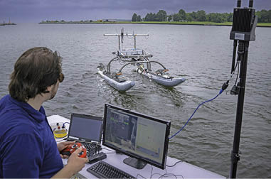 ond Koehler, a mechanical engineer at the Naval Air Warfare Center Aircraft Division, demonstrates unmanned swarm mission planning software at Naval Air Station Patuxent River’s West Basin Marina in Md. on June 17, 2025. The software helps the Navy plan missions with unmanned systems by simulating drone, sensor, and arrangement combinations to achieve mission goals at sea ultimately providing warfighters faster and more effective decision making. (U.S. Navy photo by Todd Frantom)