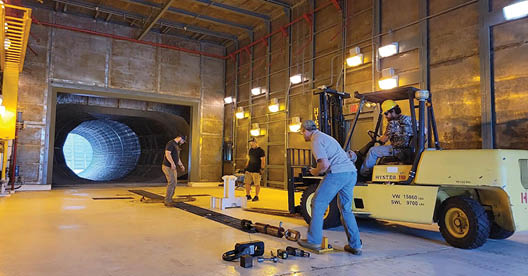 Navy team members facilitate instrumentation setup during a recent load test as part of the collaborative effort between the Common Aviation Support Equipment program office (PMA-260) and Naval Facilities Engineering Systems Command (NAVFAC) to revitalize the T-10 Test Cell Facility that will enable engine testing in a noise-suppressed environment at Naval Air Station Patuxent River, Md. (U.S. Navy photo)