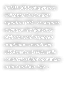 An MH 60S Seahawk from Helicopter Sea Combat Squadron (HSC) 25 prepares to land on the flight deck of the forward dep...
