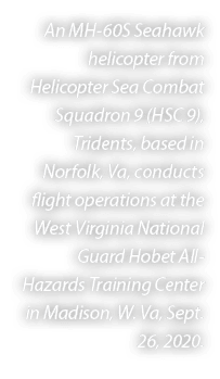 An MH 60S Seahawk helicopter from Helicopter Sea Combat Squadron 9 (HSC 9), Tridents, based in Norfolk, Va, conducts ...
