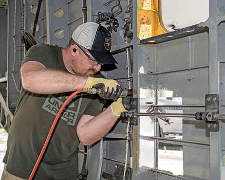 Aaron Weld, Fleet Readiness Center East (FRCE) H-53 work leader and member of the depot’s Forward Deployed Combat Repair (FDCR) Team, performs repairs on a CH-53E Super Stallion during a training exercise designed to enhance the aircraft maintenance and repair knowledge and capabilities the FDCR Team may need if deployed.