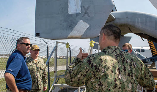 Cmdr. Joseph Stewart, right, a Reservist on the Naval Air Systems Command (NAVAIR) Forward Deployed Combat Repair (FDCR) Team, discusses the results of the FDCR training exercise with Fleet Readiness Center East (FRCE) Commanding Officer Capt. Randy Berti, middle, and Executive Director David Rose, left. FRCE hosted seven NAVAIR Reservists May 12-16 to train alongside the depot’s FDCR Teams in a scenario that included making hands-on repairs to stricken MV-22 Osprey and CH-53E Super Stallion aircraft with simulated battle damage.