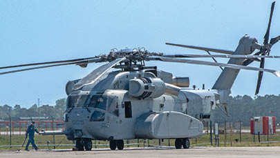 Marine Master Sgt. Richard Hughes, maintenance chief at Fleet Readiness Center East (FRCE), prepares to secure the rotor blades of a CH-53K King Stallion helicopter that arrived at the depot April 4 for routine maintenance. FRCE inducted the aircraft April 17 as the first of 14 planned for induction as part of the Age Exploration Program, Depot (AEPD); it is the first King Stallion ever inducted for depot-level maintenance. AEPD collects information regarding the aircraft’s condition through controlled testing and analysis and assists in the development of effective and efficient maintenance schedule for new aircraft. (Photo by Heather Wilburn, Fleet Readiness Center East)
