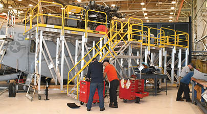 Artisans on the Fleet Readiness Center East (FRCE) H-53 aircraft line work on a CH-53K King Stallion, the first inducted for maintenance at the depot. FRCE inducted the aircraft April 17 as the first of 14 planned for induction as part of the Age Exploration Program, Depot (AEPD); it is the first King Stallion ever inducted for depot-level maintenance. AEPD collects information regarding the aircraft’s condition through controlled testing and analysis and assists in the development of effective and efficient maintenance schedule for new aircraft. (Photo by Samantha Morse, Fleet Readiness Center East)