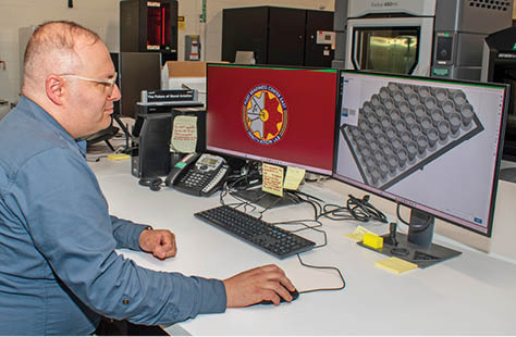 Fleet Readiness Center East Innovation Lab Lead Engineer Jeremy Bunting demonstrates the lab’s 3D printing build preparation software, which displays the model for an F-35 O-ring installation tool recently manufactured by the lab. The two-person team at the Innovation Lab used additive manufacturing – commonly referred to as 3D printing – to fulfill a critical request for 2,000 tools, and successfully completed the order under two weeks. Within days, the effort put tools in aircraft maintainers’ hands across the U.S. Marine Corps, Navy and Air Force. The turnaround time represented less than 10% of the estimated six months procurement would have taken through traditional acquisition methods. (Photo by Heather Wilburn, Fleet Readiness Center East)