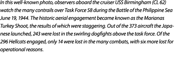 In this well known photo, observers aboard the cruiser USS Birmingham (CL 62) watch the many contrails over Task Forc...