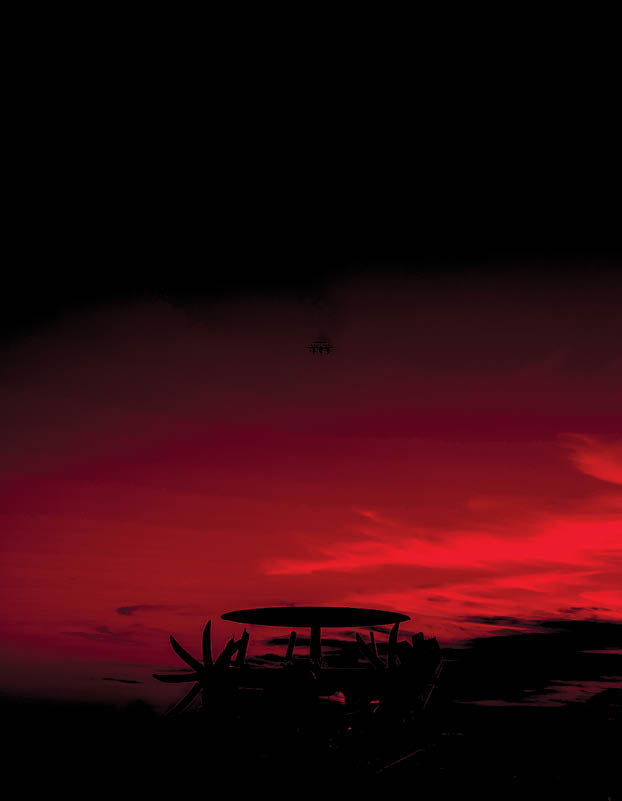 An E-2D Hawkeye attached to Airborne Command and Control Squadron (VAW-120) flies away from Nimitz-class aircraft carrier USS George Washington (CVN 73) after performing a touch and go Jan. 14, 2024. George Washington is underway in support of carrier qualifications. (U.S. Navy photo by Mass Communication Specialist 3rd Class August Clawson)