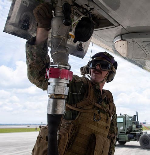 Navy Expeditionary Warfighting Development Center (NEXWDC), Navy Expeditionary Combat Command (NECC), Navy Expeditionary Logistics Support Group (NAVELSG), Navy Cargo Handling Battalion 1 (NCHB-1) and 2nd Navy Expeditionary Logistics Regiment (2nd NELR) personnel conduct a Limited Objective Experiment at Naval Air Station Jacksonville, Florida, April 22, 2026. The experiment evaluated expeditionary refueling solutions for aircraft platforms operating in austere and distributed environments, demonstrating how Navy expeditionary logistics capabilities can extend operational reach, increase aircraft endurance and provide commanders greater flexibility in contested maritime environments. (U.S. Navy photo by Chief Mass Communication Specialist Jose L. Hernandez)