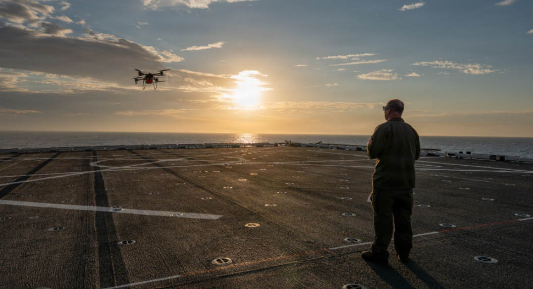 The Marine Corps recently conduct shipboard testing with the TRV-150C Tactical Resupply Unmanned Aircraft System (TRUAS) aboard a San Antonio-class amphibious transport dock (LPD), marking a significant milestone in advancing ship-to-shore and ship-to-ship resupply solutions for Combat Logistics Battalions (CLBs).