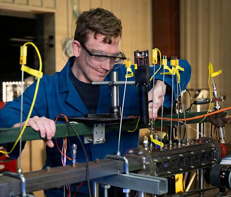 Clayton Geipel, Ph.D., U.S. Naval Research Laboratory (NRL) aerospace engineer, adjusts fittings on an optically-accessible solid-fuel slab burner at NRL’s Combustion Lab in Chesapeake Beach, Maryland, Jan. 15, 2026. Researchers and engineers at NRL use an optically-accessible solid-fuel slab burner to perform combustion experiments at conditions relevant to solid-fuel ramjet flight. (U.S. Navy photo by Jonathan Sunderman)