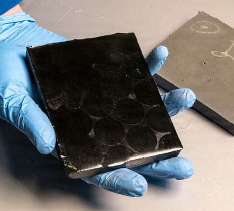 Featured are composite fuel slabs at the U.S. Naval Research Laboratory’s (NRL) Combustion Lab in Chesapeake Beach, Maryland, Jan. 15, 2026. The fuel slabs contain a polymer binder, featuring carbon black (left) to increase its absorption of radiant energy and aluminum (right) to increase its energy density. Researchers and engineers at NRL use these fuel slabs with an optically-accessible solid-fuel slab burner to perform combustion experiments at conditions relevant to solid-fuel ramjet flight. (U.S. Navy photo by Jonathan Sunderman)