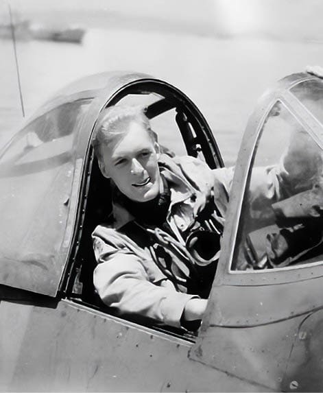 A man is sitting in a cockpit of a plane, smiling and looking out the window. AI generated content