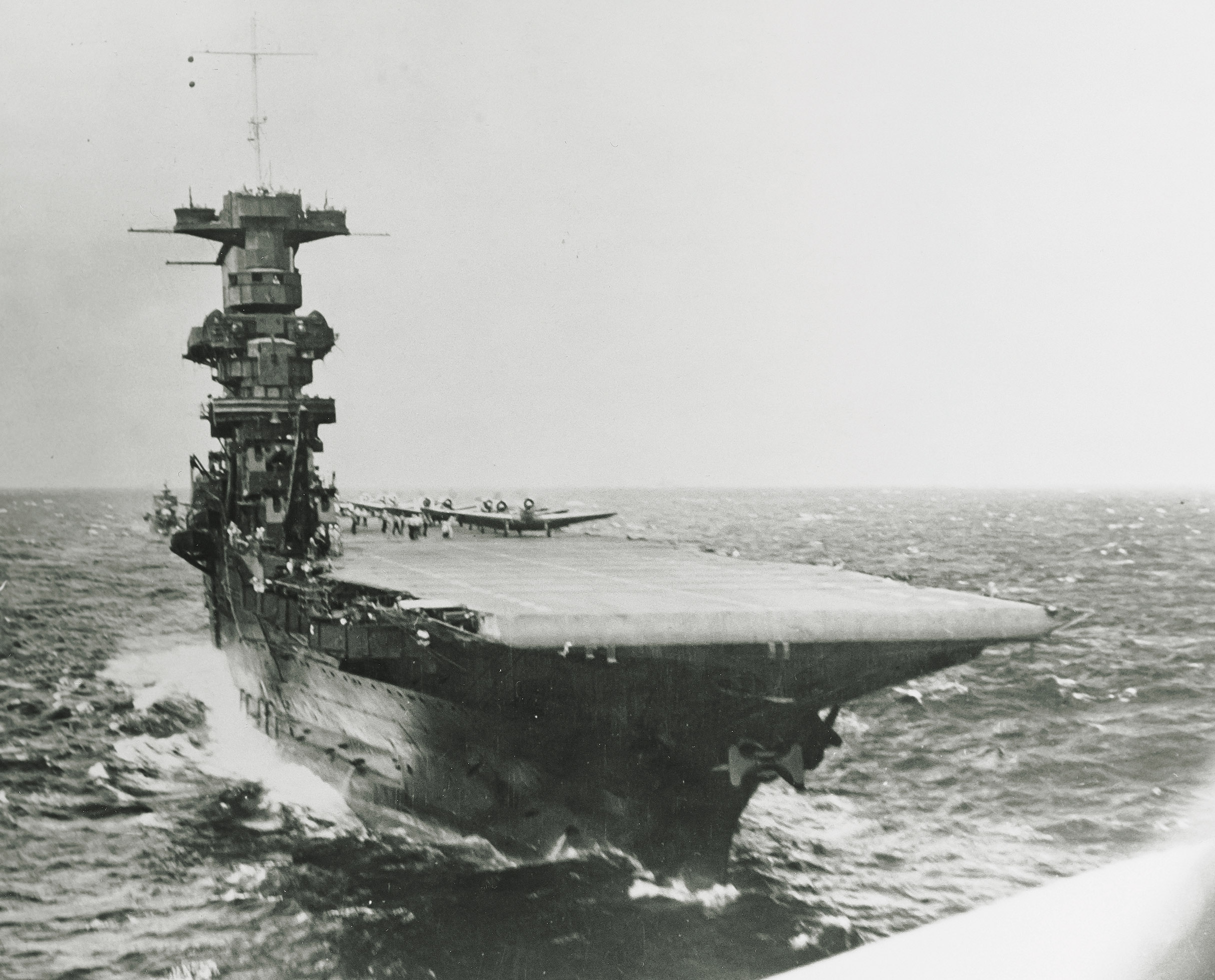 USS Saratoga (CV 3) launching planes, circa summer 1941, as seen from the rear cockpit of a plane that has just taken off. USS Saratoga (CV 3) launching planes, circa summer 1941, as seen from the rear cockpit of a plane that has just taken off.