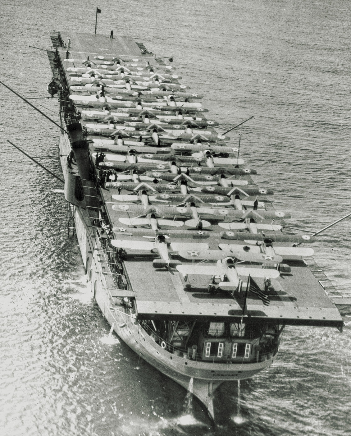 USS Langley (CV 1) in Pearl Harbor with 34 planes on her flight deck, May 1928. USS Langley (CV 1) in Pearl Harbor with 34 planes on her flight deck, May 1928.
